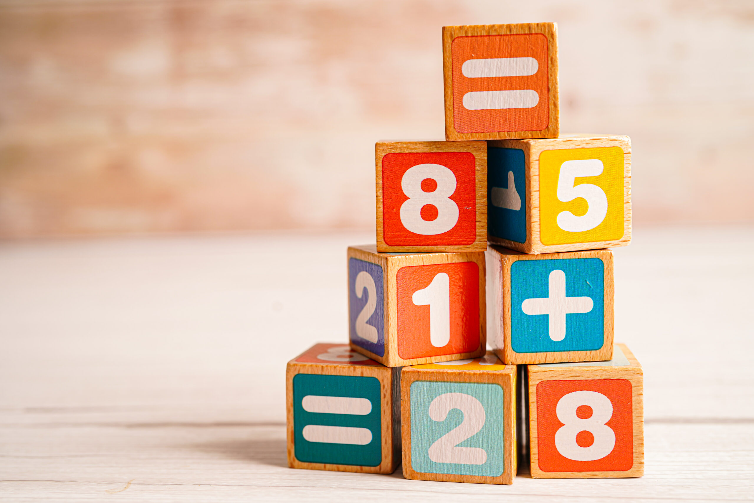 Number wood block cubes for learning Mathematic, education math concept.